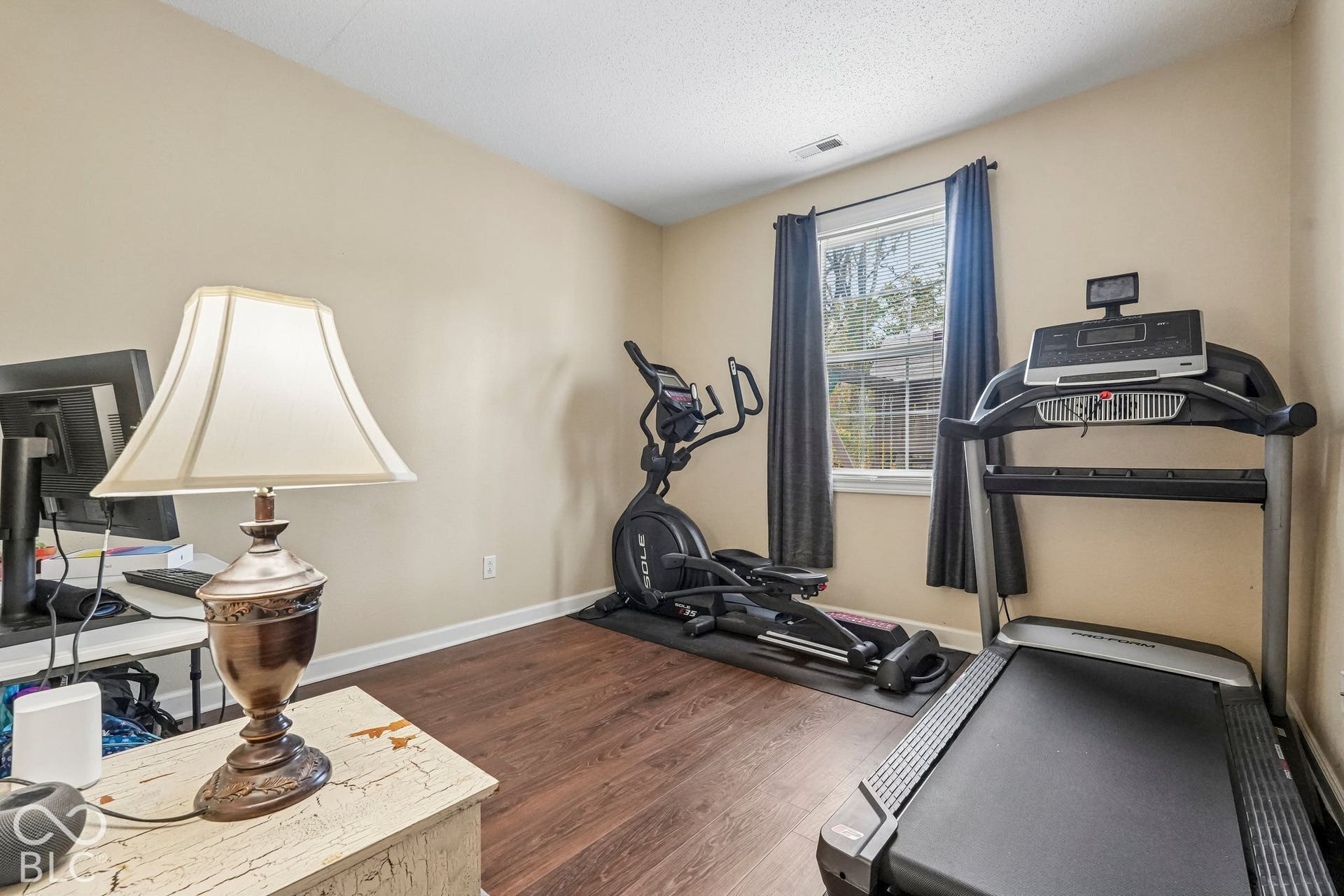 Main level boasts a private office or work out area