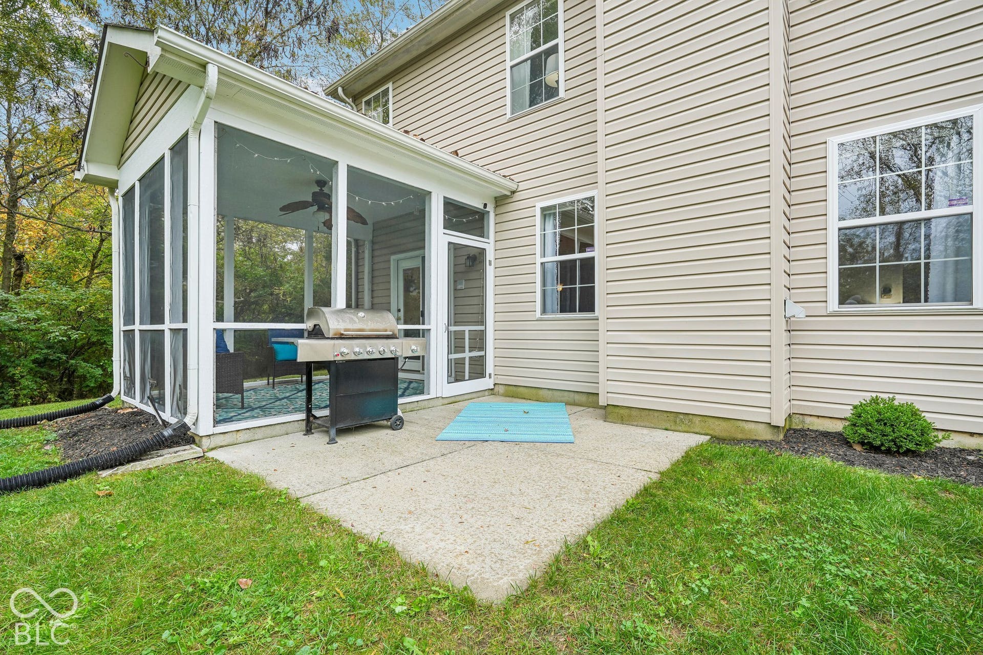 Open patio is located off the covered back porch