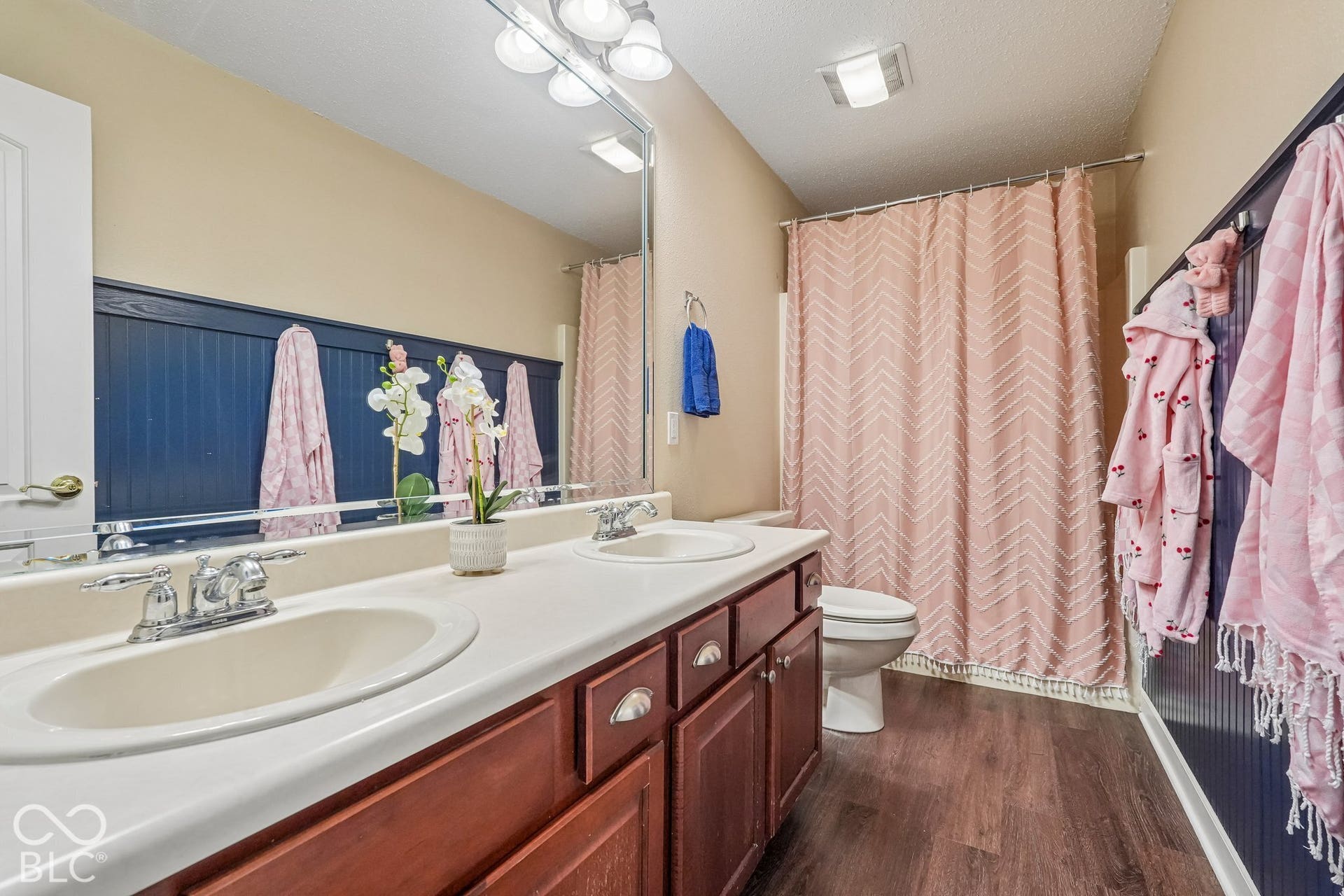 Upstairs full bathroom has been updated and offers double sinks and tub/shower combo