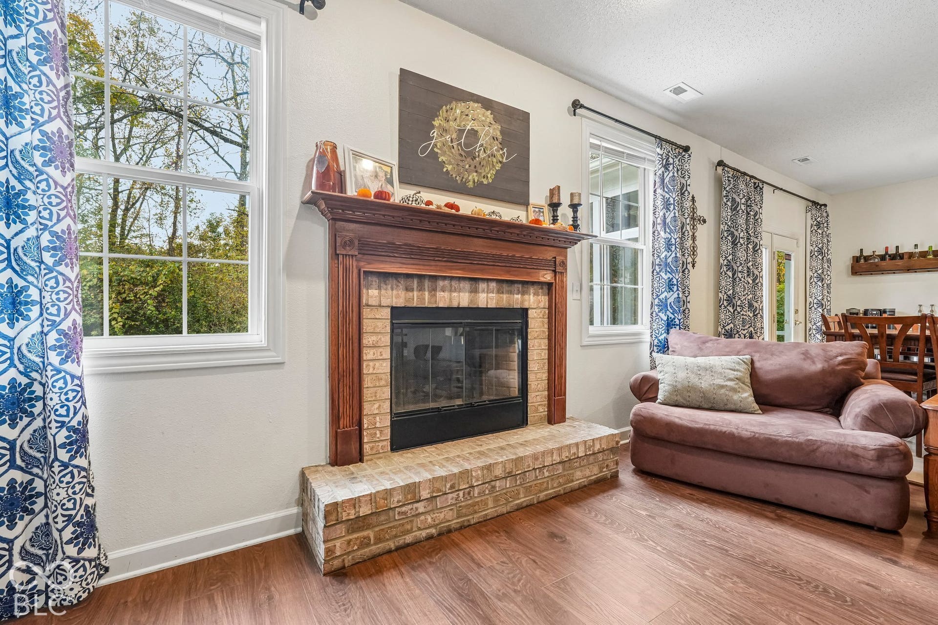 Elegant mantel and raised brick hearth