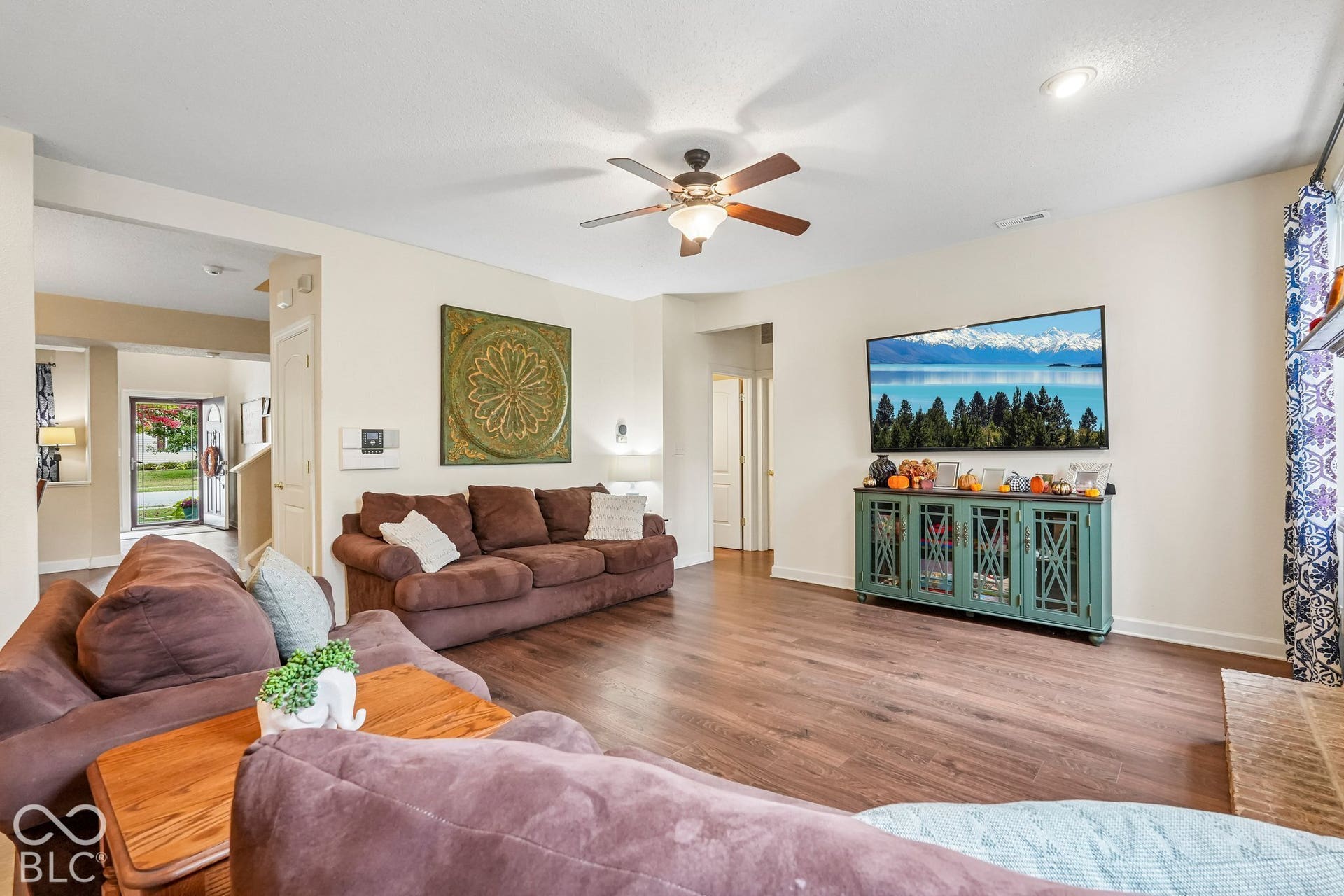 Great room is spacious with tall ceilings and newer flooring