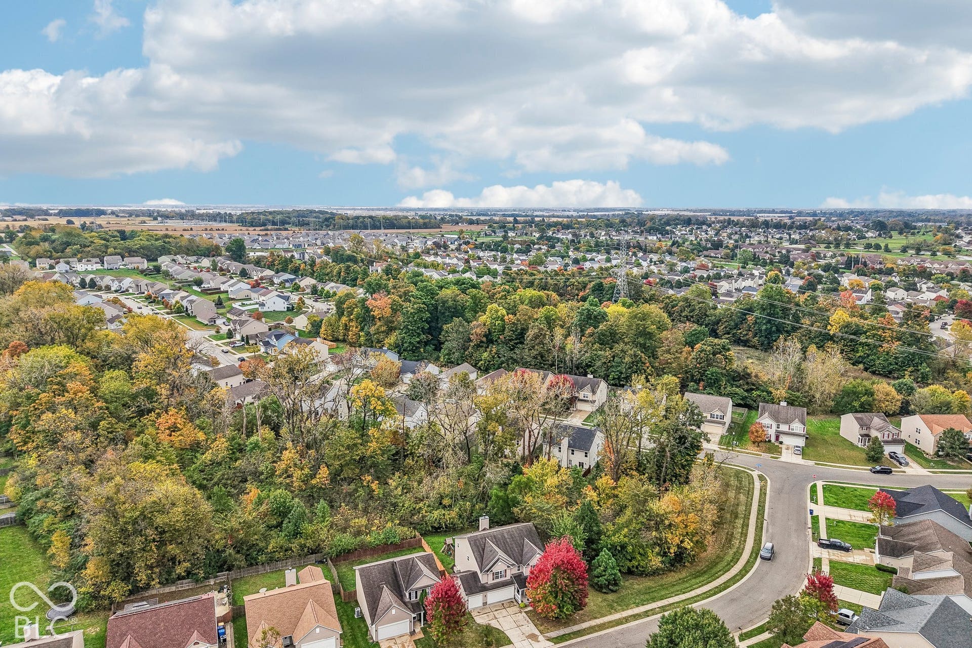 Aerial view of the home and surrounding area