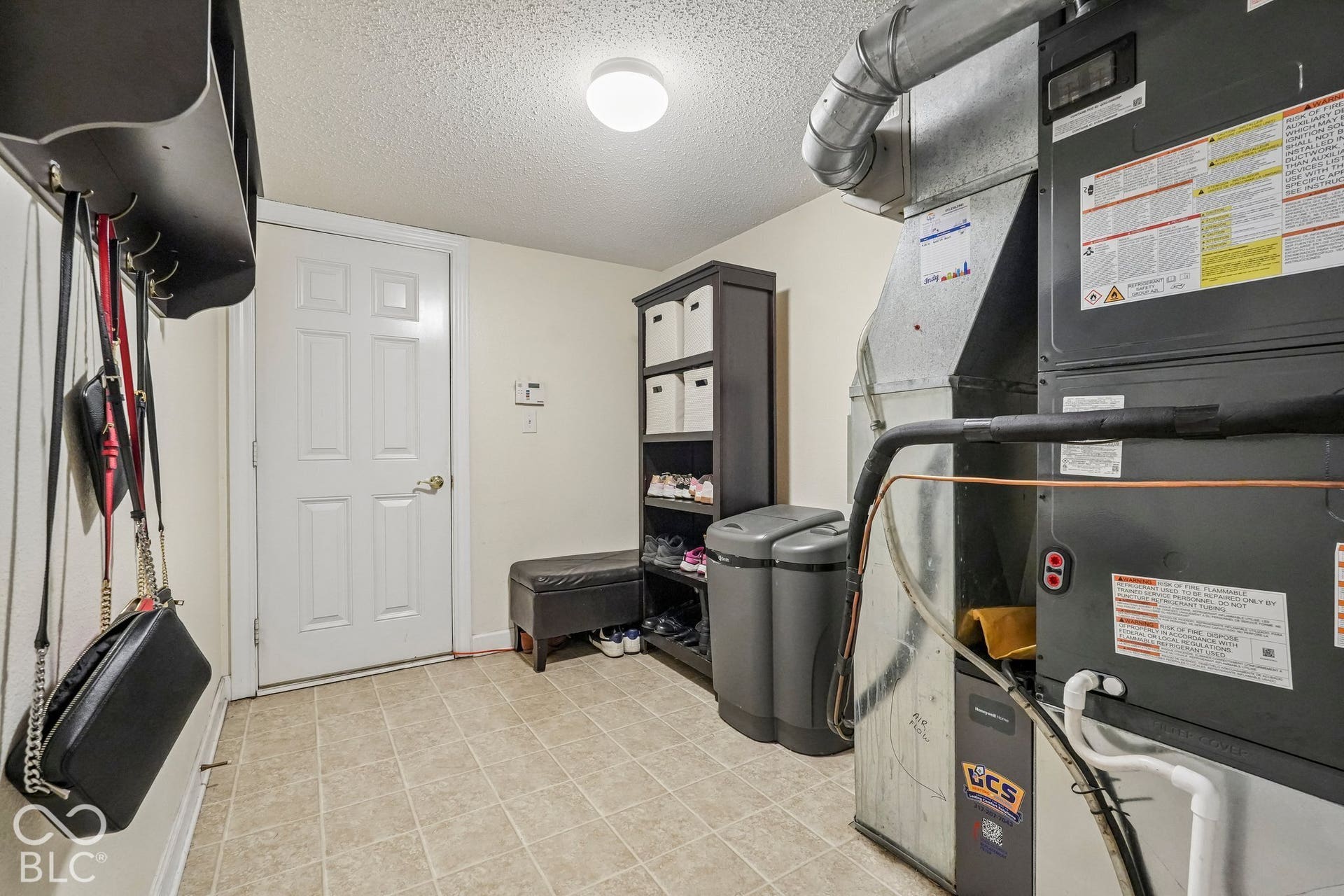 Large drop zone / mud room area off of the 3-car garage with tons of space