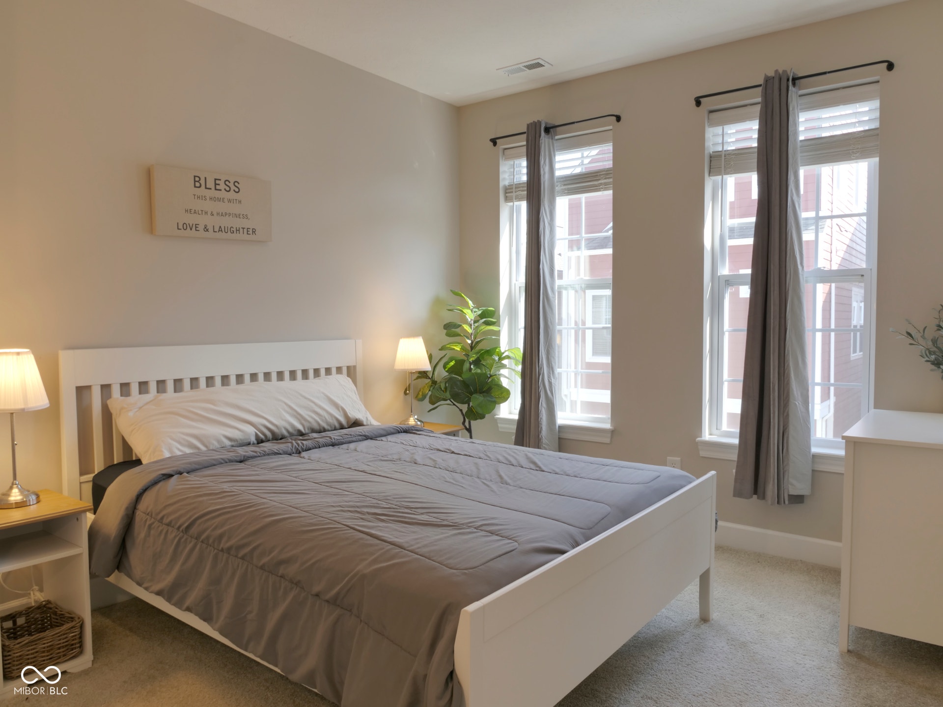 Neutral-toned walls complement plush carpeting
