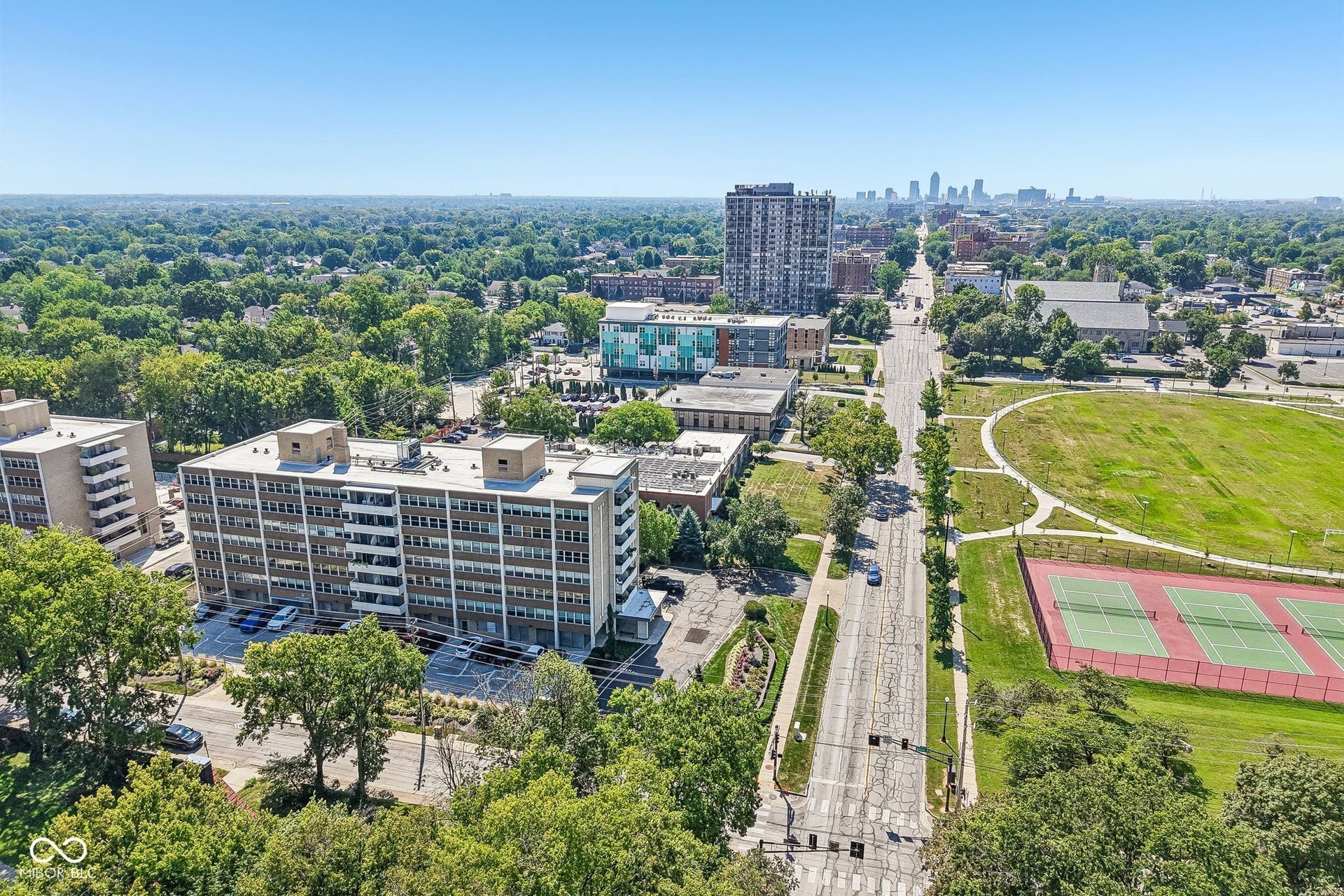Expansive green spaces with tennis courts and walking paths