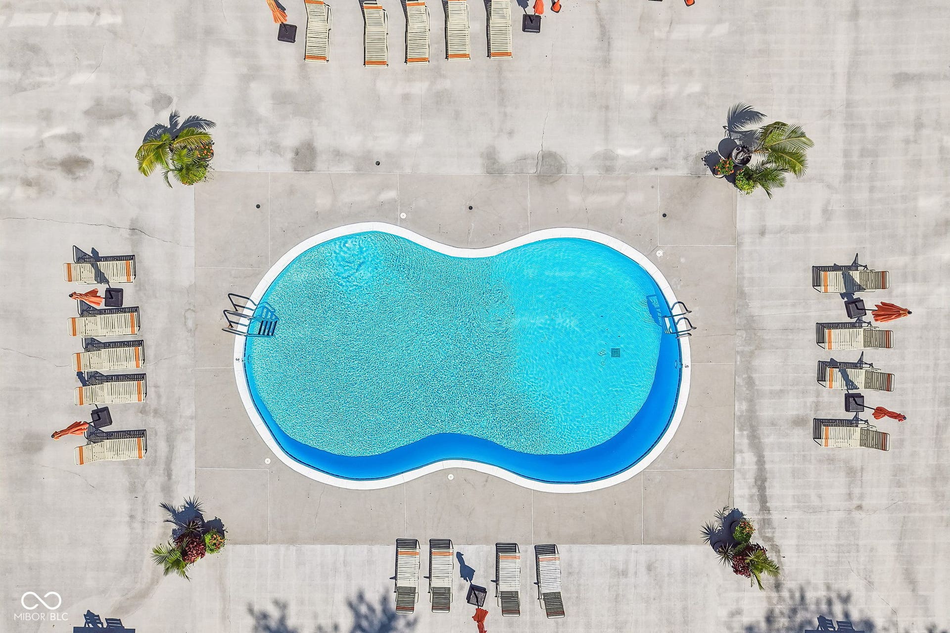 East Building: swimming pool access with a light blue interior finish and an integrated bench