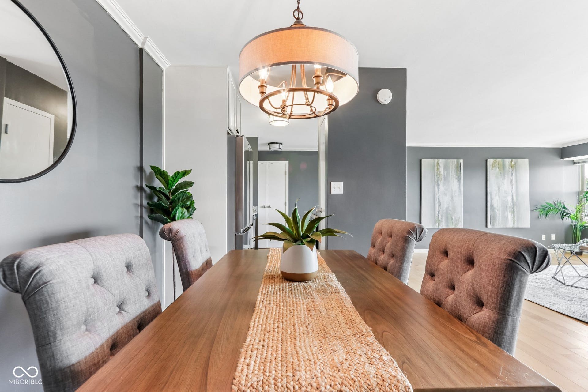 Hardwood-style flooring, crown molding, and recessed lighting