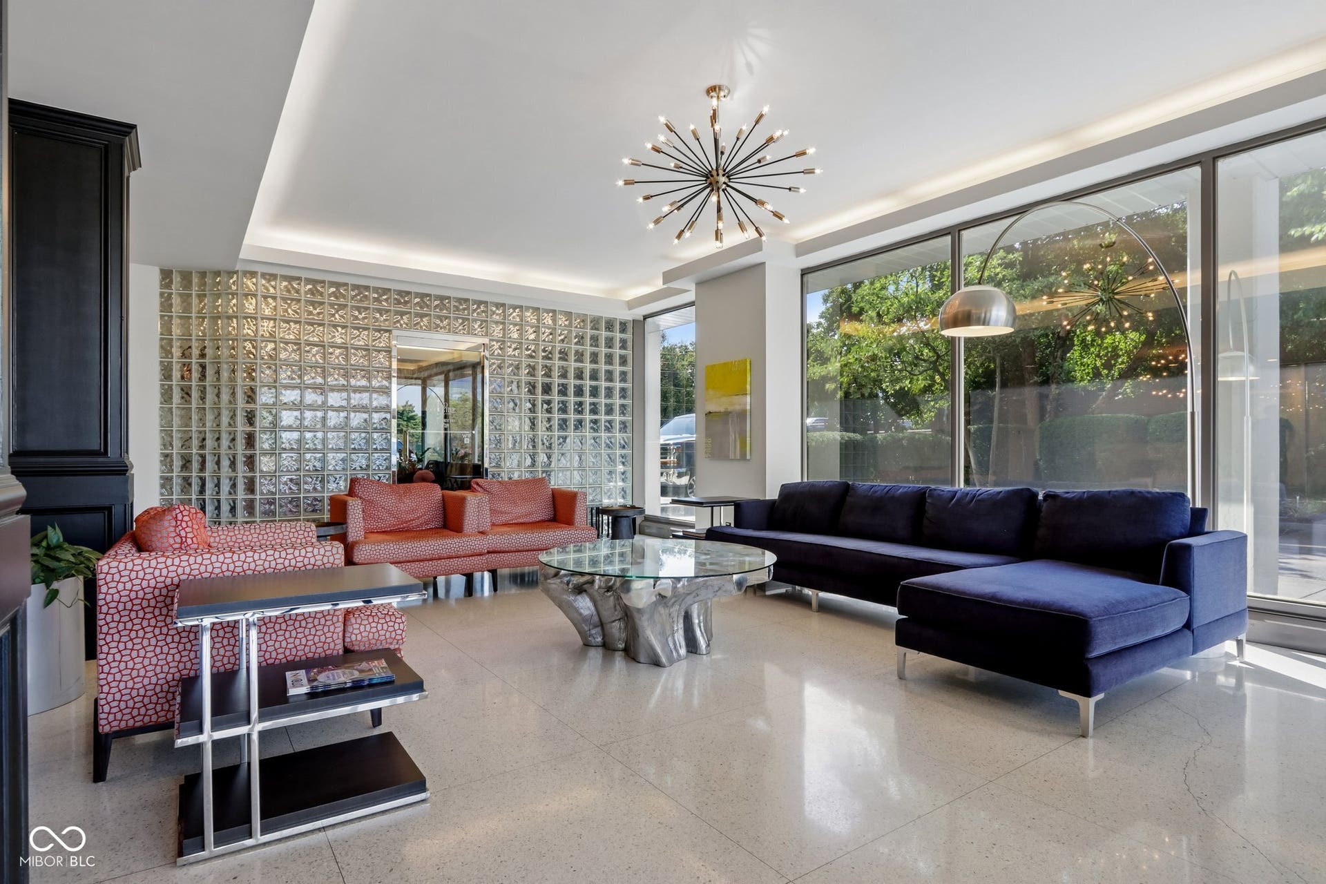 West Building: Floor-to-ceiling windows, recessed lighting, glass block wall, and a sputnik chandelier