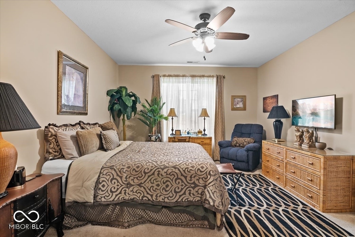 Primary bedroom at back of home.  Full bath ensuite - double sinks, walk in closet and shower.