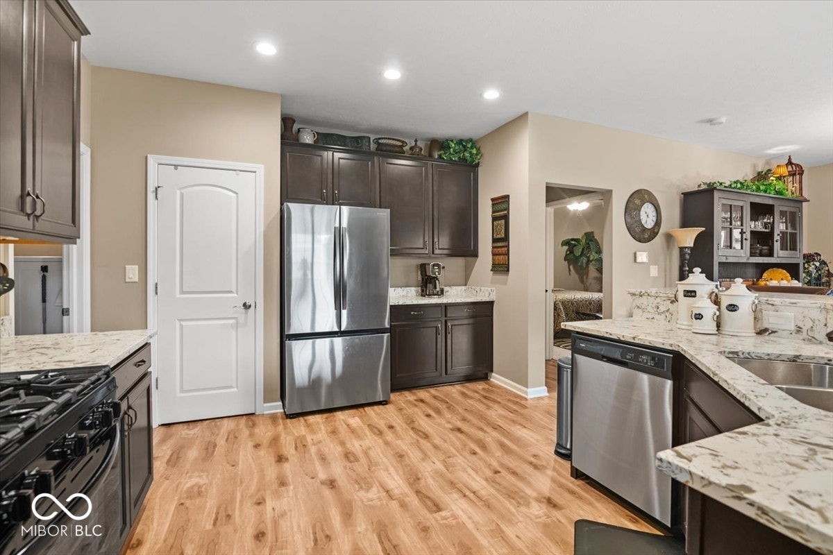 Stainless steel appliances, upgraded cabinets, quartz counter with an elevated design, abundant counter space