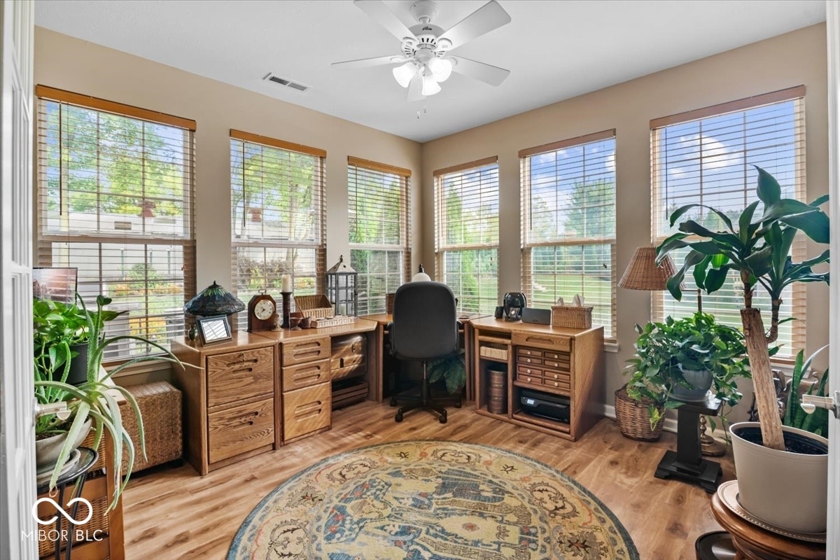 Dedicated Office w/ glass French doors & double wall of windows overlooking backyard