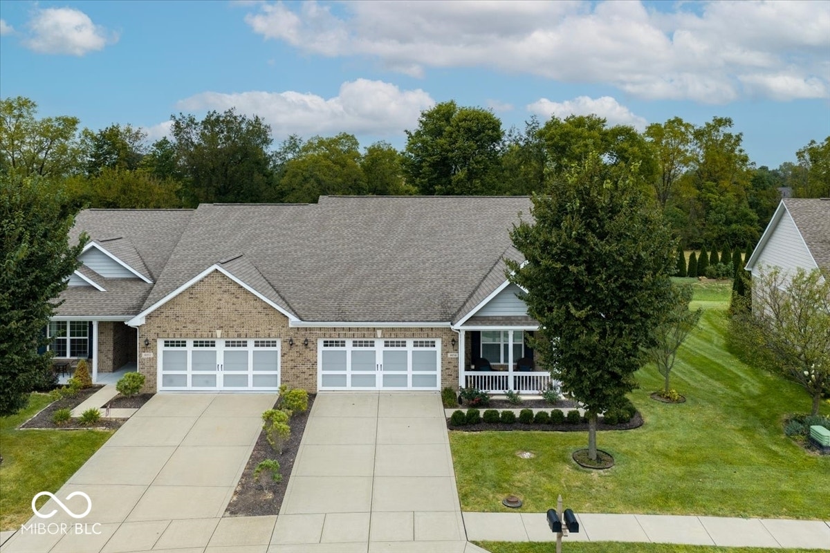 Desirable unit with covered porch in front and in back; and on private backyard lot