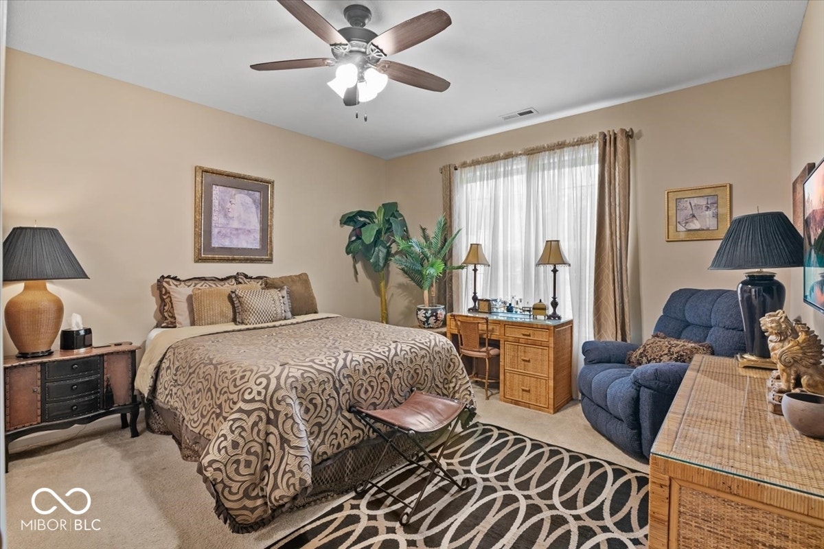 Primary bedroom at back of home.  Full bath ensuite - double sinks, walk in closet and shower.