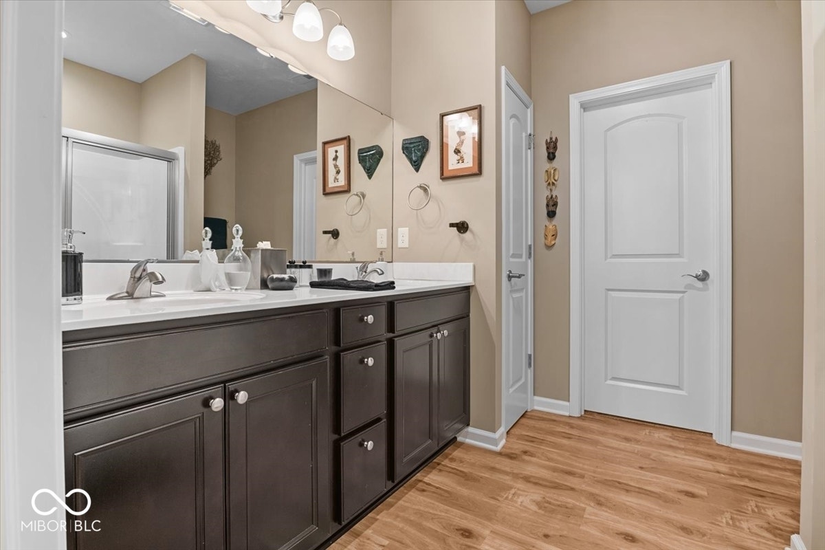 Primary bedroom at back of home.  Full bath ensuite - double sinks, walk in closet and shower.
