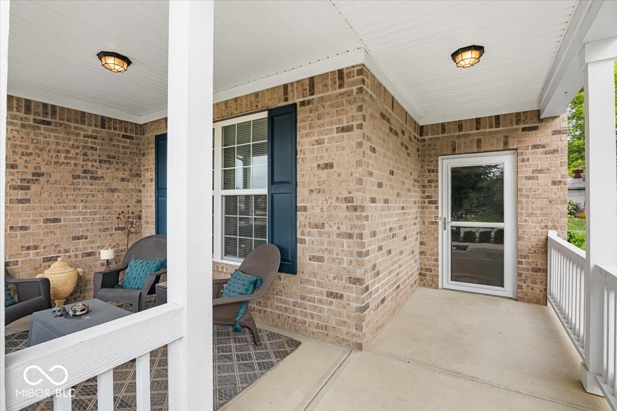 Covered front sitting porch - great place to relax and have a quiet moment. Double as even more sqft and outdoor living space.  Full brick surround