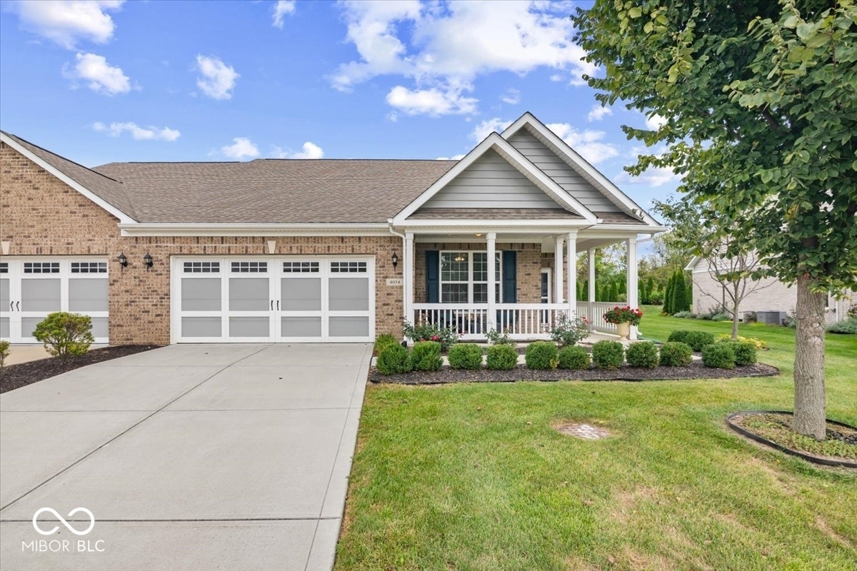 So much curb appeal on this fully brick-wrapped, 2018 built, 1-level ranch home the crisp Grant Park at Prestwick neighborhood