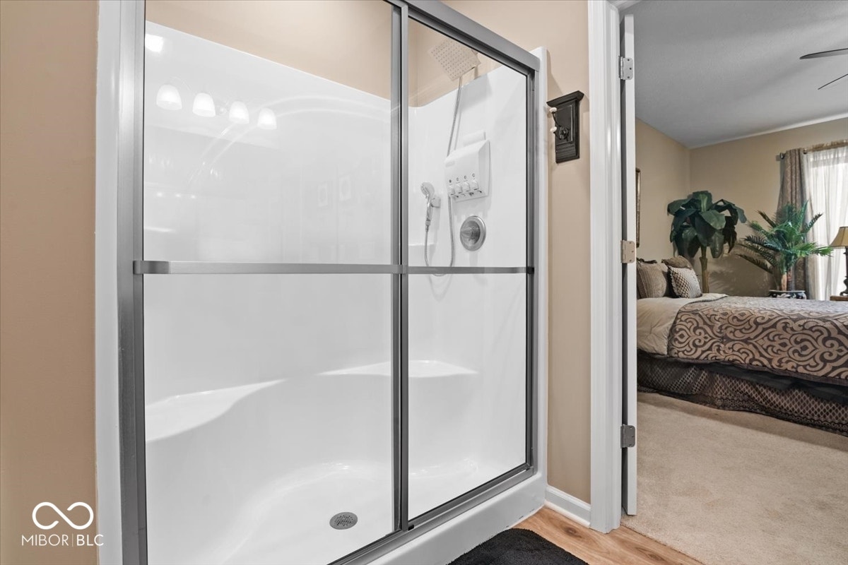 Primary bedroom at back of home.  Full bath ensuite - double sinks, walk in closet and shower.