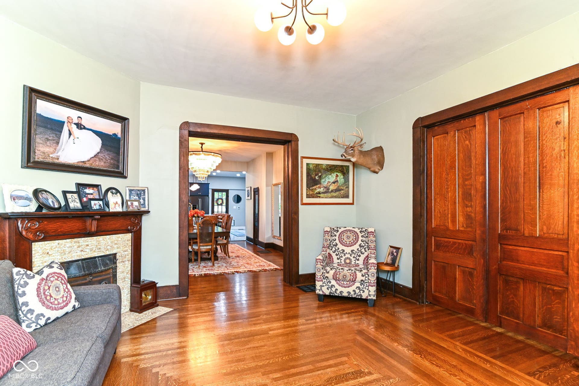 Historic character shines with original pocket doors, period woodwork, built-ins and the home's original fireplace as an architectural focal point.