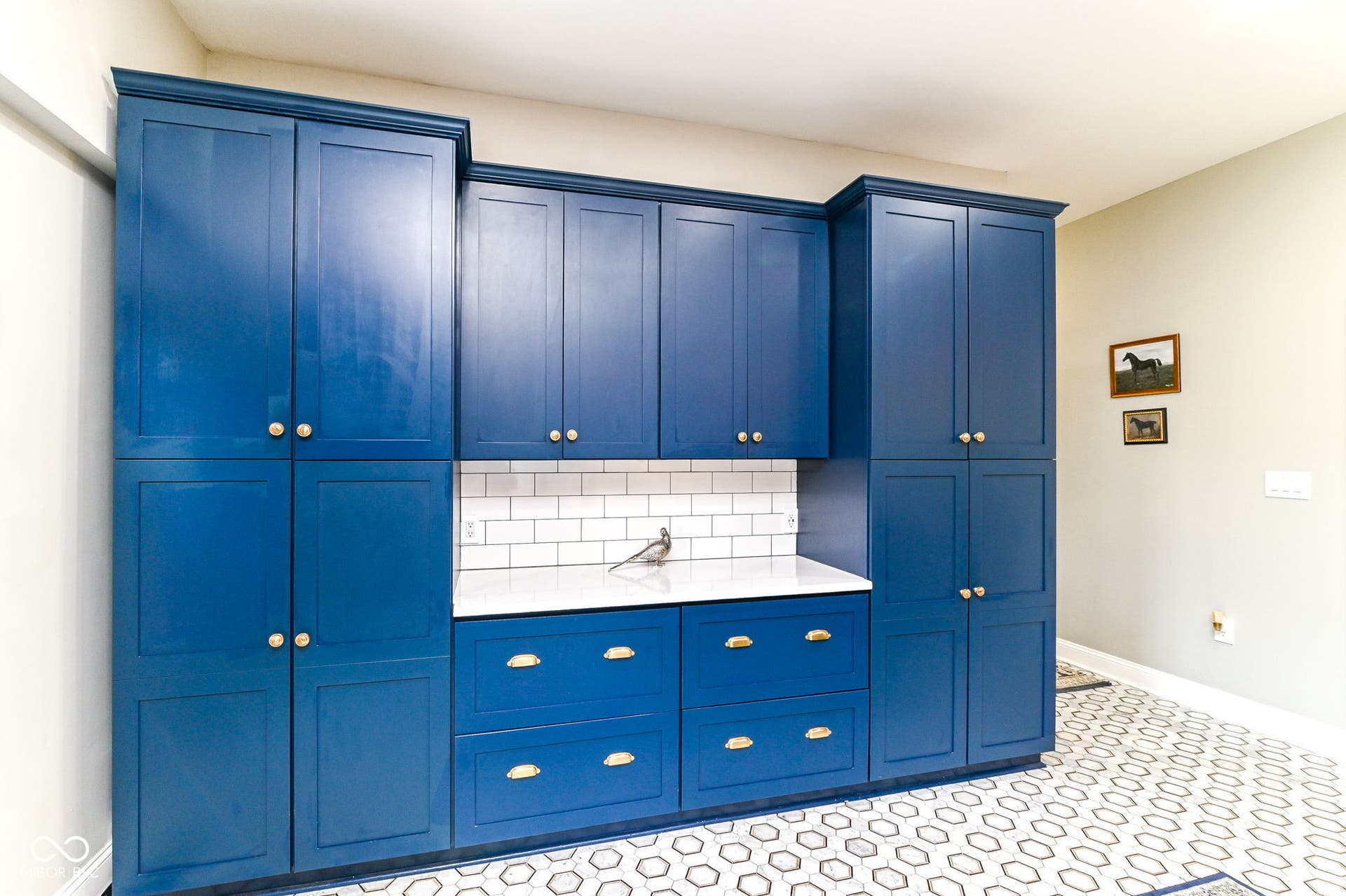 Custom floor-to-ceiling cabinetry creates exceptional kitchen storage plus a built-in coffee bar - beautiful and practical.