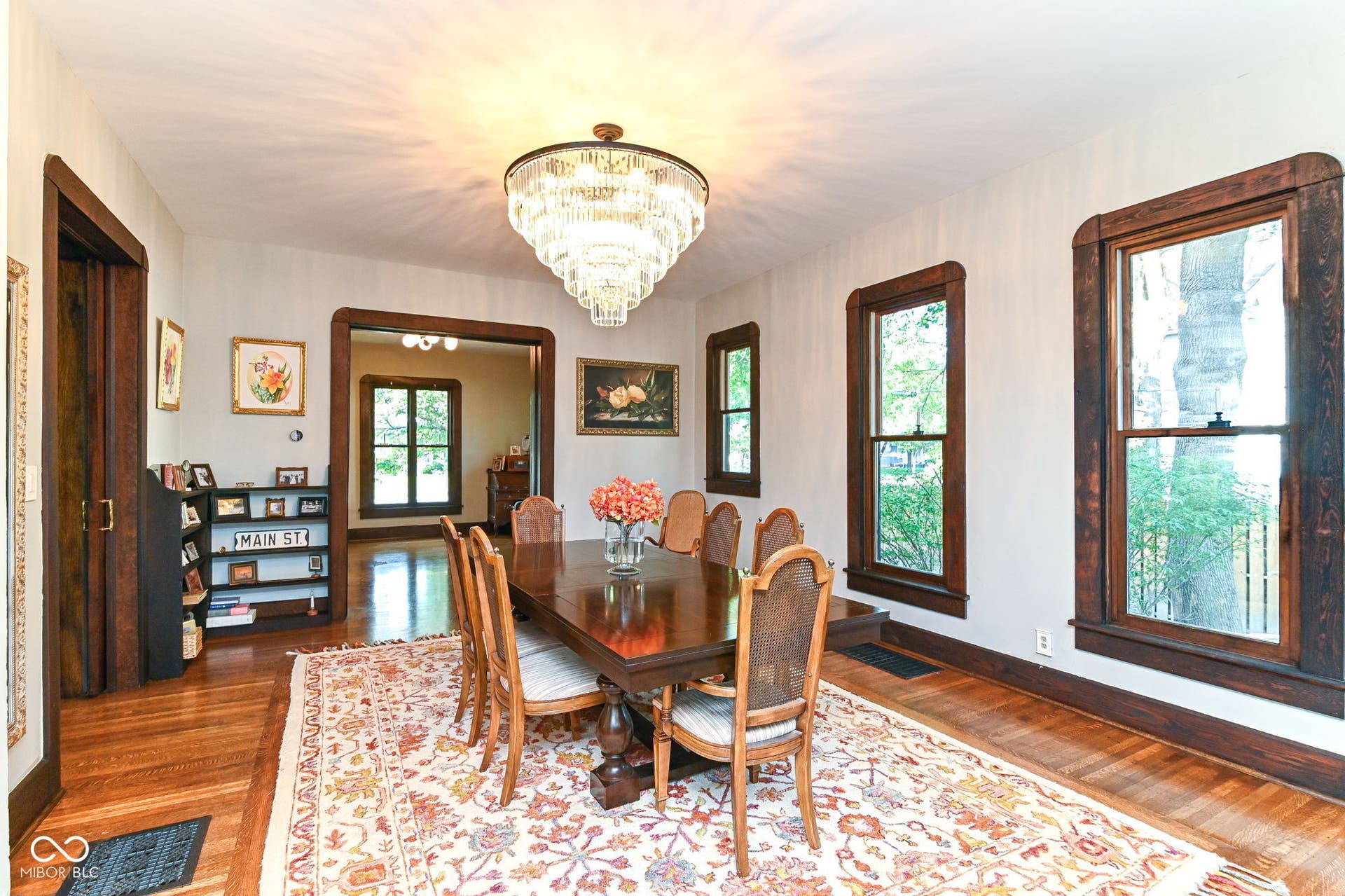 Host holidays and dinner parties in this impressive dining room with tall windows, restored floors and classic historic-home character.