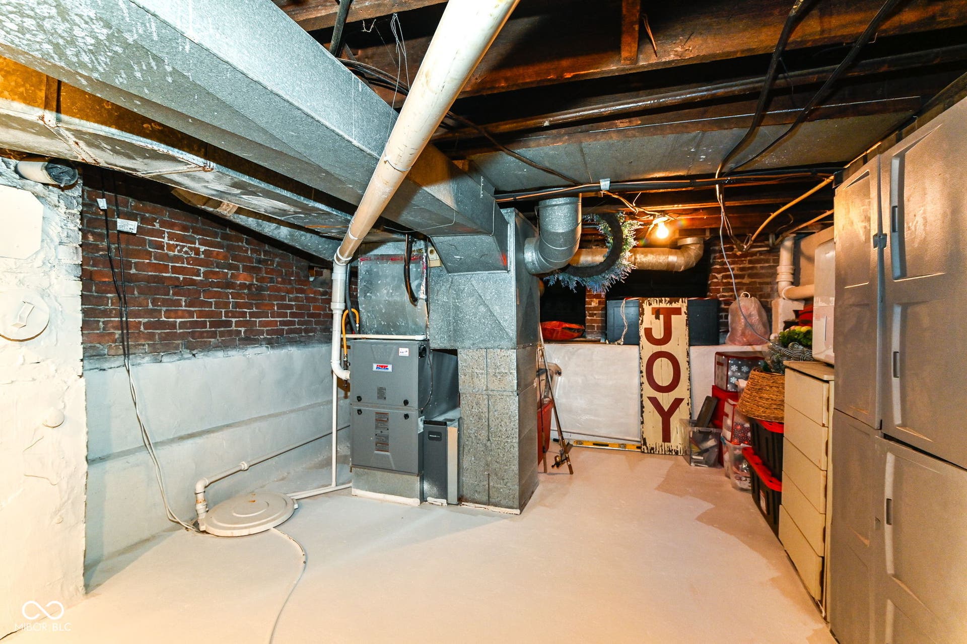 Basement utility and storage area houses updated mechanicals and offers additional room to organize, store and work.