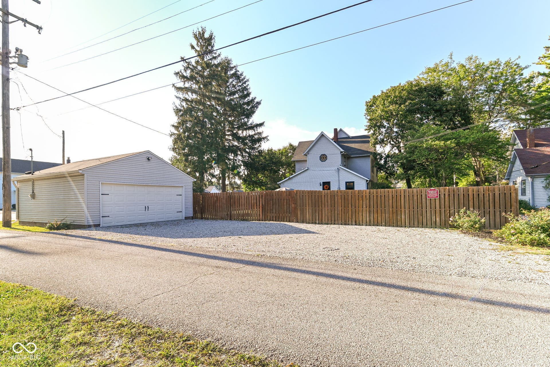 Detached 2-car garage plus abundant side parking adds everyday convenience just steps from the fully fenced backyard.