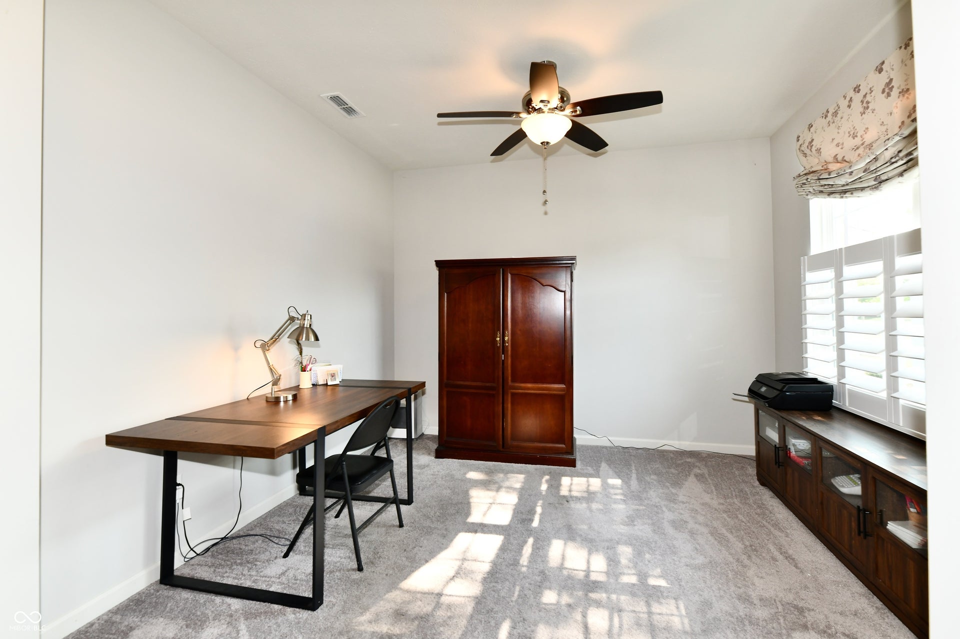 Recessed lighting, ceiling fan with integrated light, neutral wall paint, plantation shutters, and soft carpet flooring