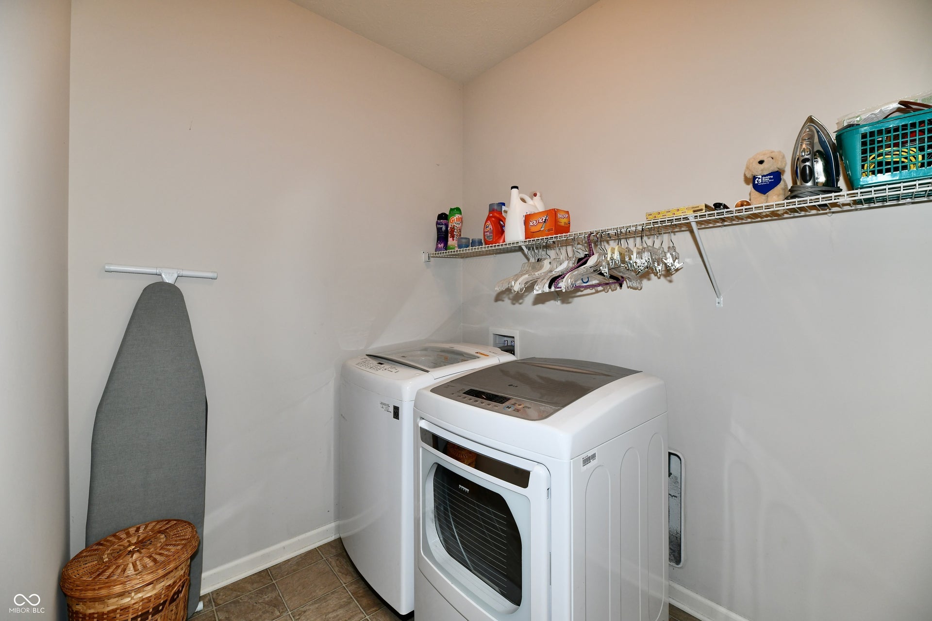 Shelf for supplies and hanging clothes