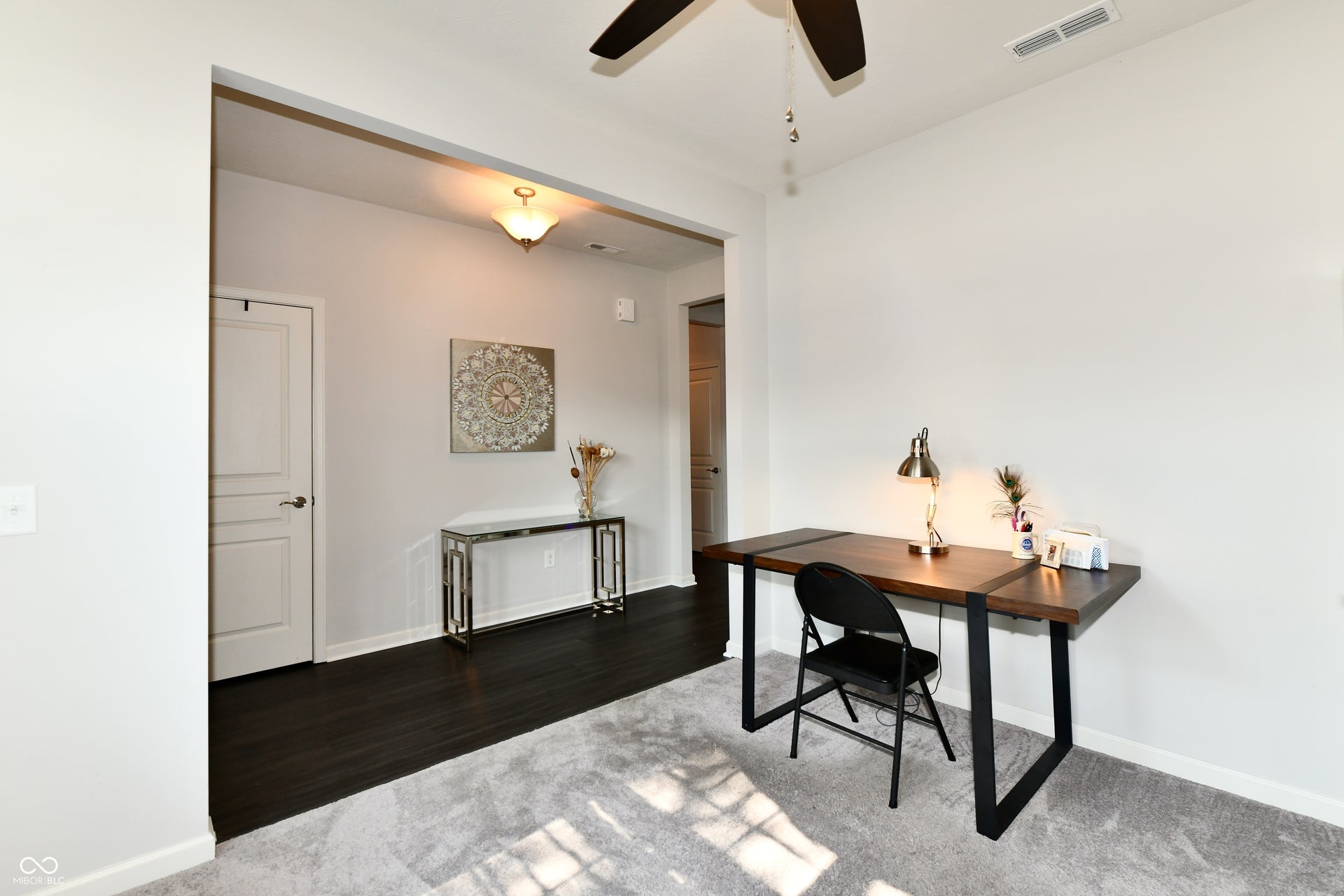 Recessed entryway featuring dark wood-finish flooring