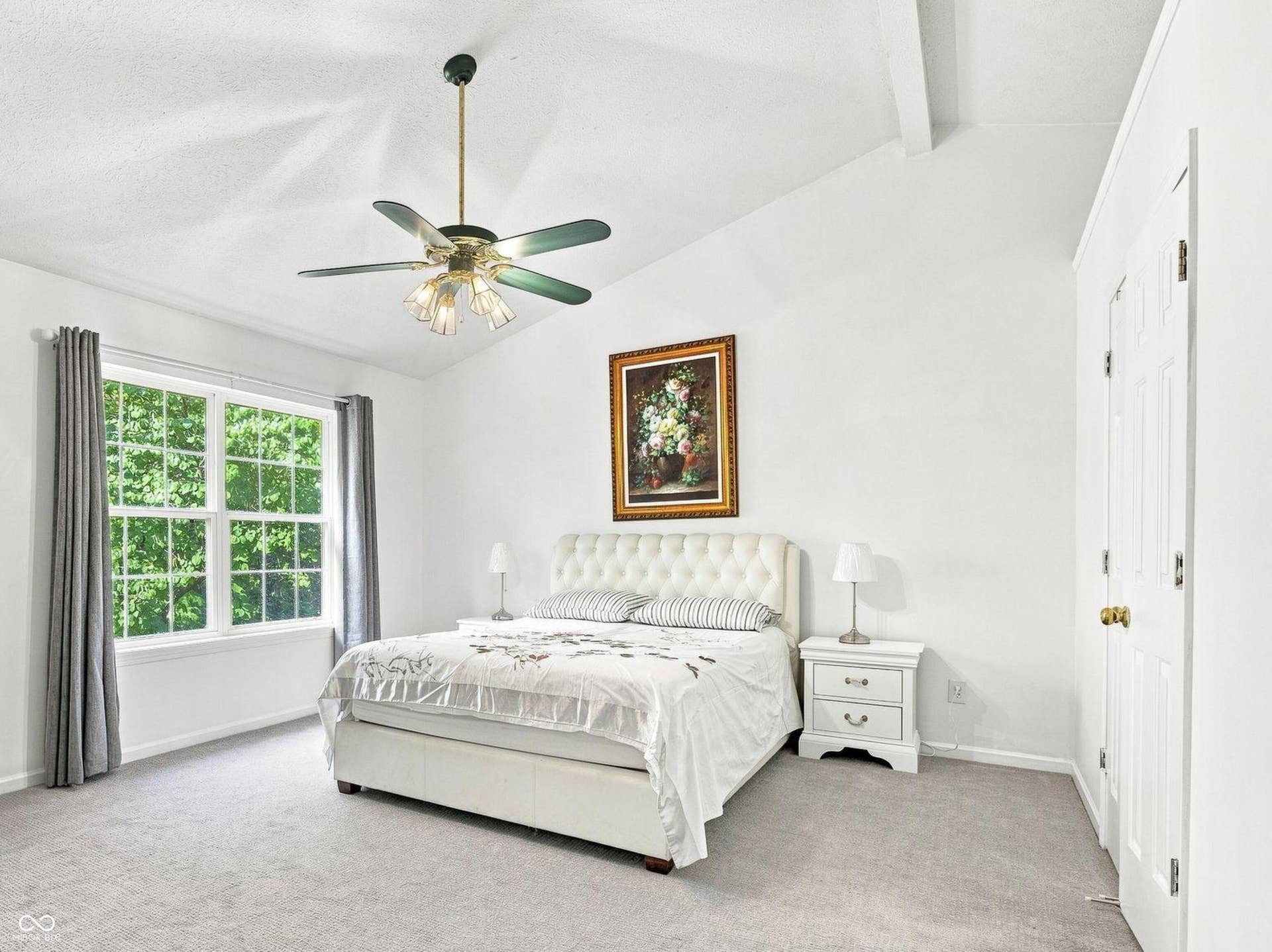Second floor primary bedroom with vaulted ceilings