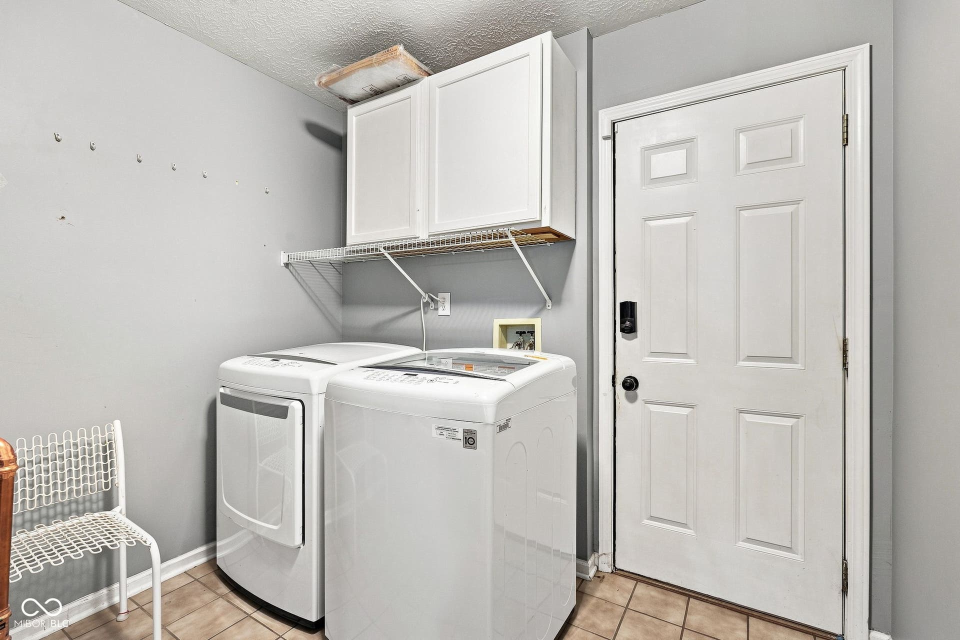 First floor laundry/mud/utility room with garage access.