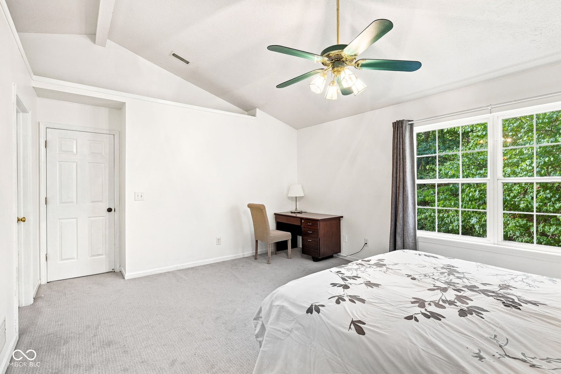 Second floor primary bedroom with vaulted ceilings