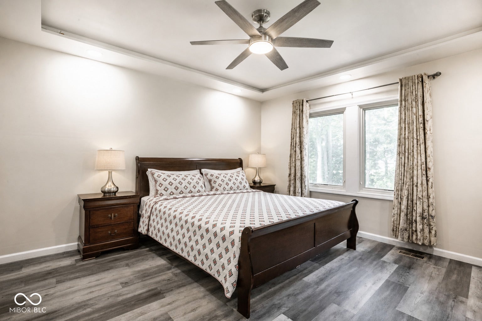 5145 Michigan Road, Indianapolis, IN 46228 Main floor en suite features trey ceiling, lvp flooring, attached luxurious bath and all new windows.