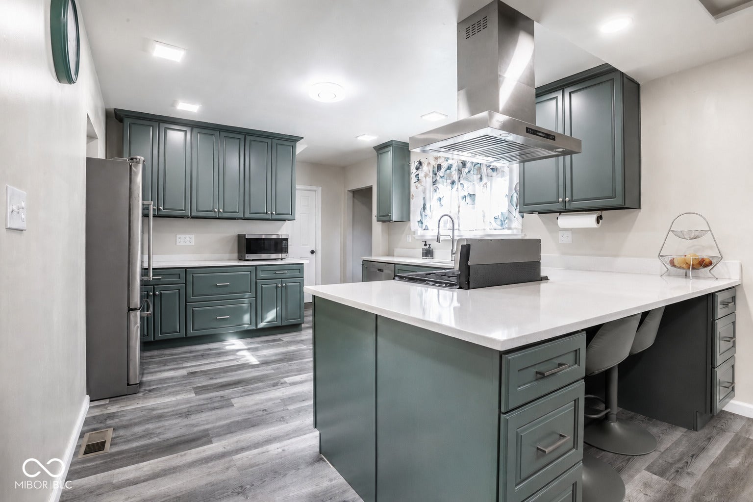 5145 Michigan Road, Indianapolis, IN 46228 Updated kitchen with quartz counters, LVP flooring, recessed lighting, stainless appliances. Counter seating.