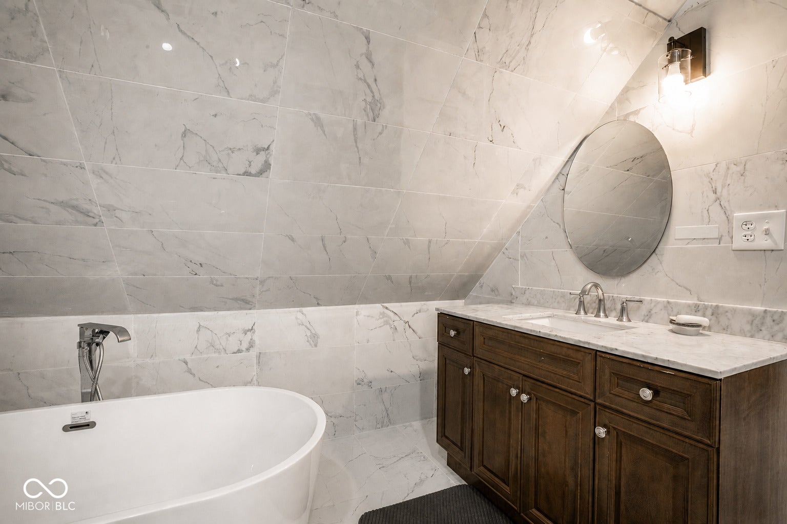 5145 Michigan Road, Indianapolis, IN 46228 Dual sinks, soaking tub, marble tiled walls.