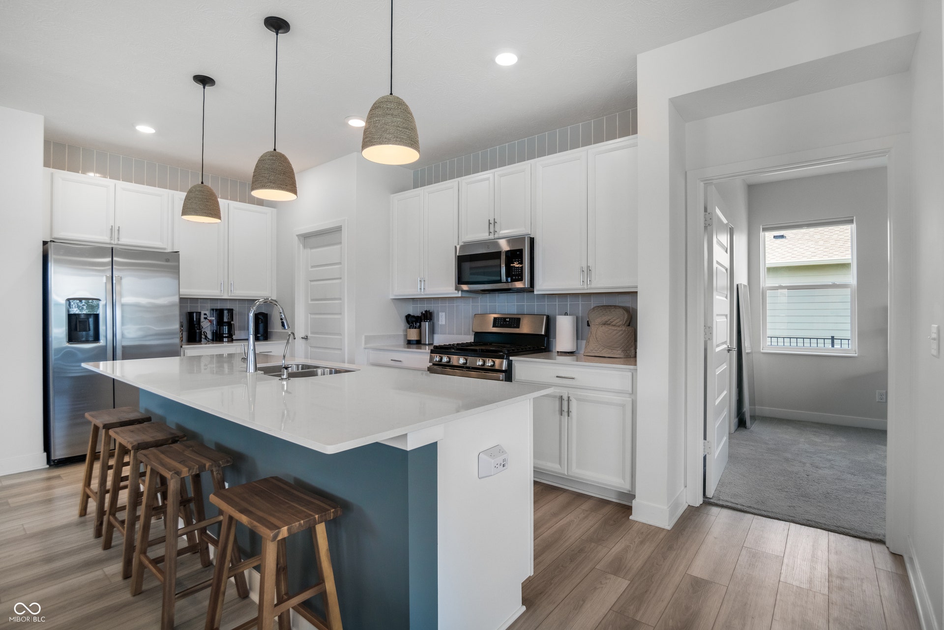 Kitchen with quartz countertops, and less than 3 years old stainless steel appliances!
