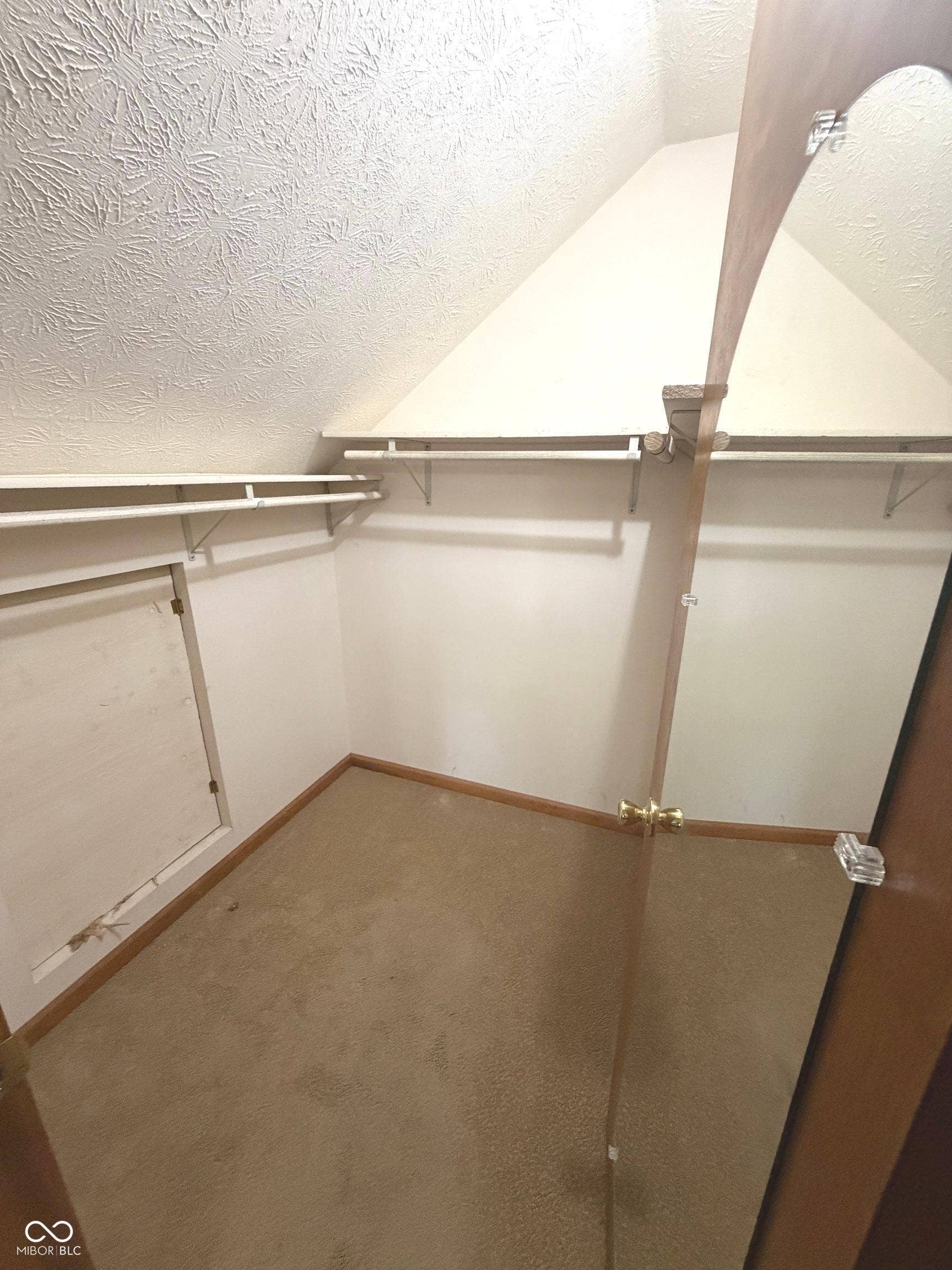 Primary Bedroom walk-in closet