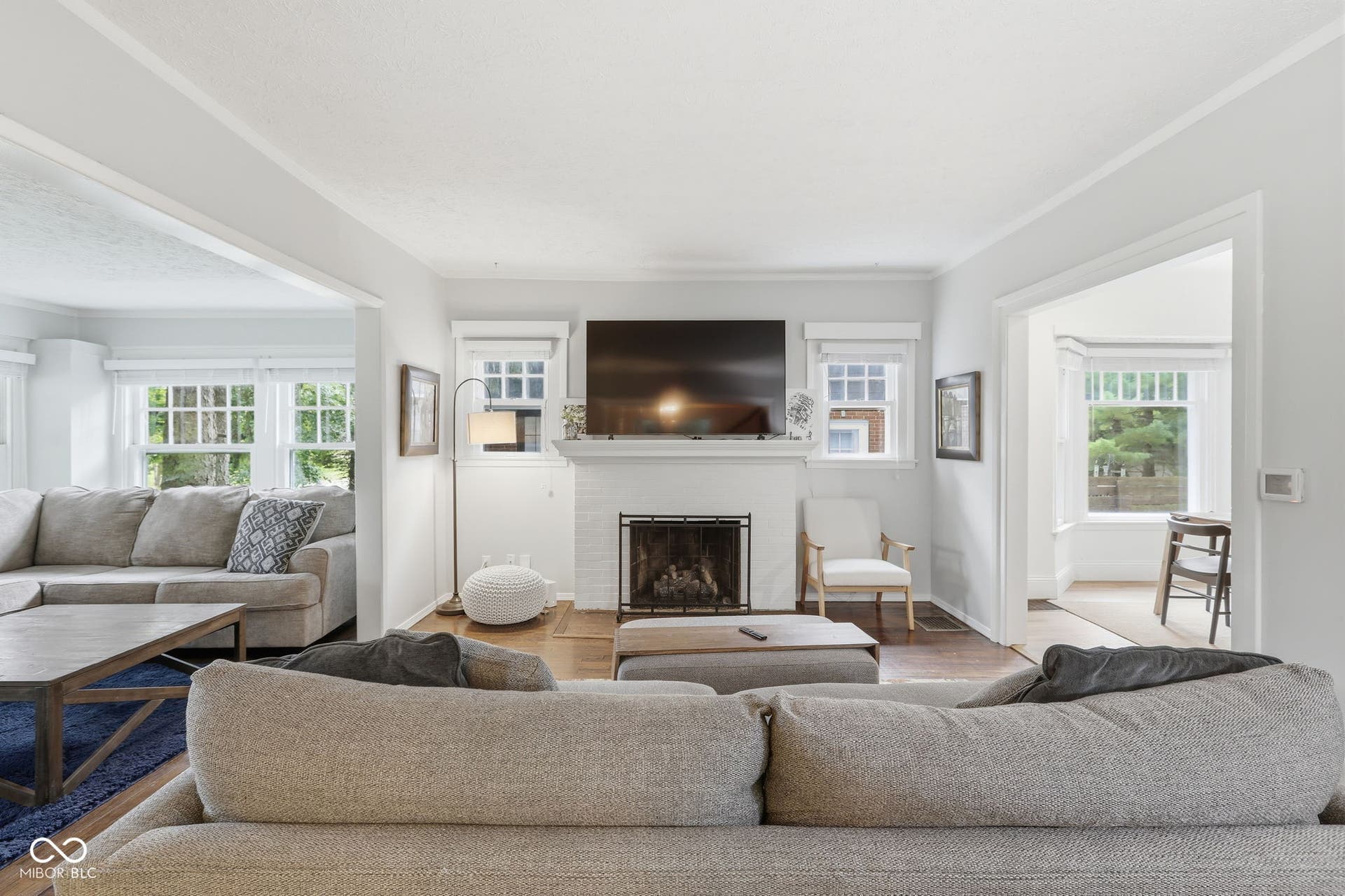 White painted brick fireplace with a black firebox