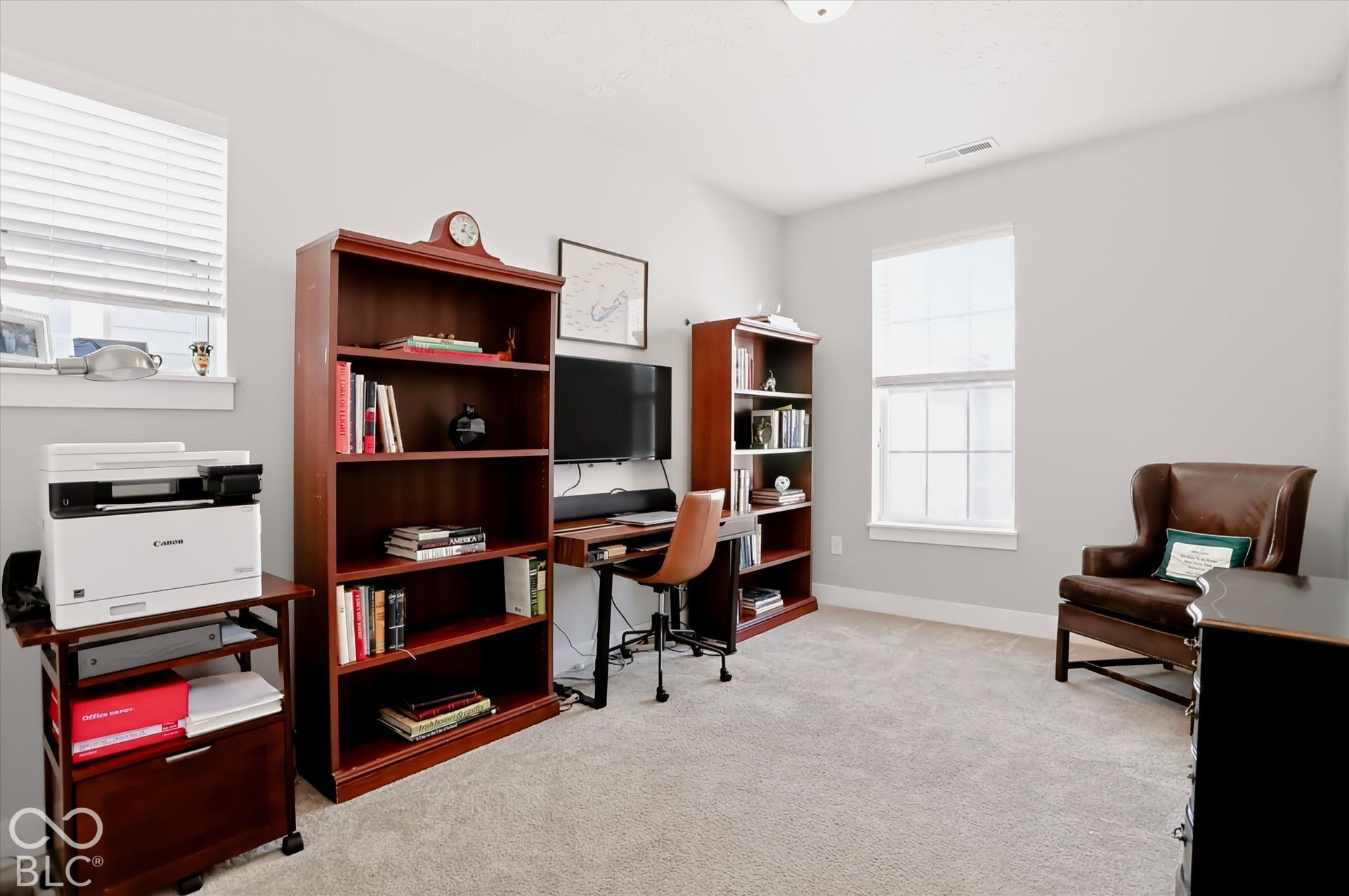 Bedroom 3 currently used as an office. Neutral wall paint throughout
