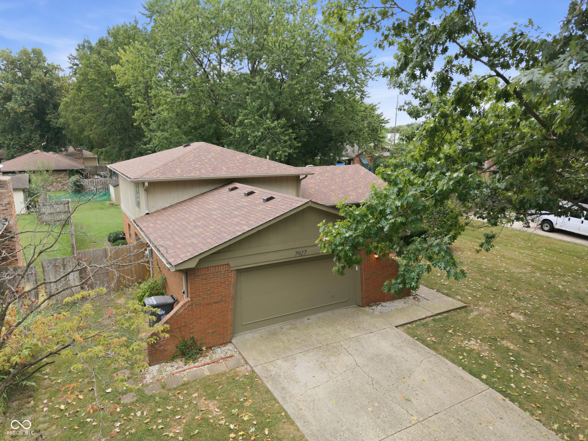 7927 Hoop Road, Indianapolis, IN 46217 Brick and siding exterior with a shingle roof