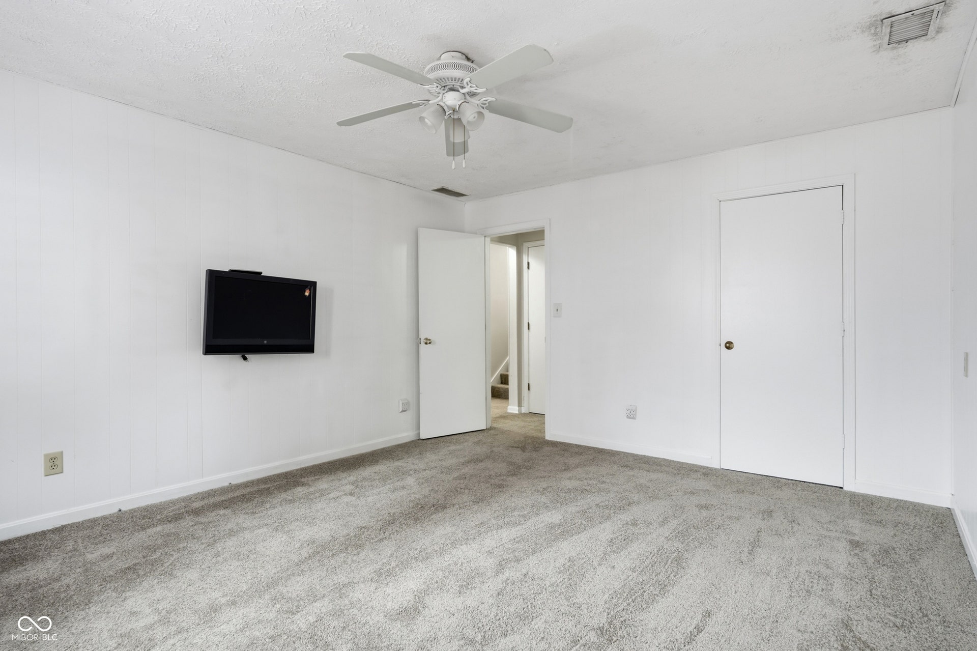 7927 Hoop Road, Indianapolis, IN 46217 Lower level bedroom 4, wall-to-wall carpeting and white walls