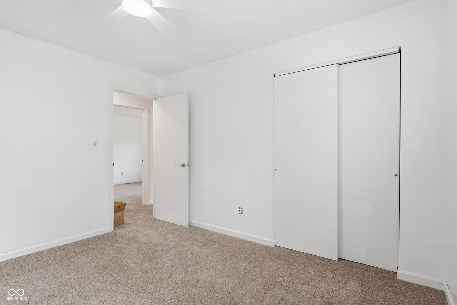 7927 Hoop Road, Indianapolis, IN 46217 Upper level bedroom 3, neutral-toned carpeted flooring, white painted walls, and ceiling-mounted fan fixture