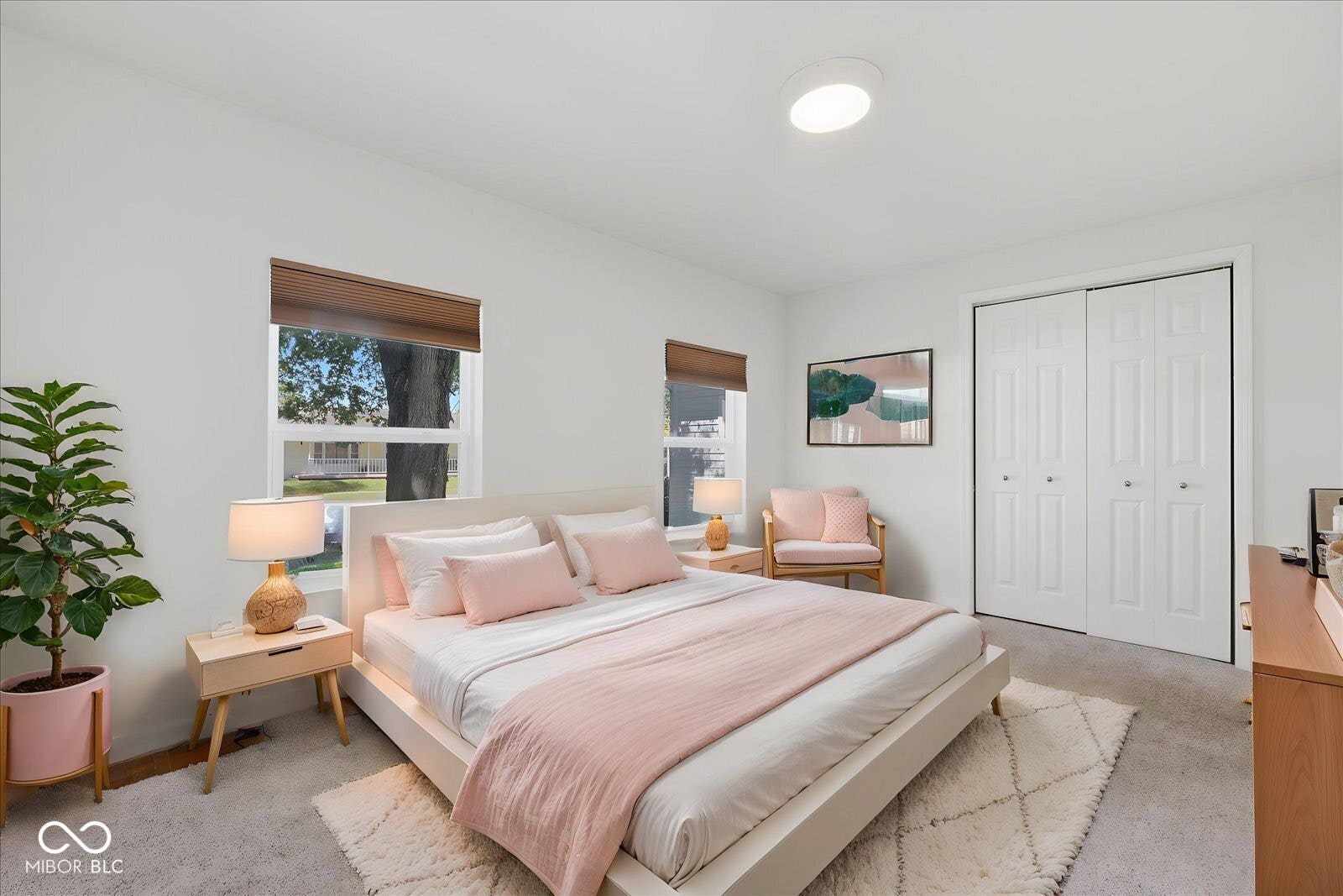 Virtually Altered - Carpeted flooring, white walls, two windows with blinds, and white bi-fold closet doors