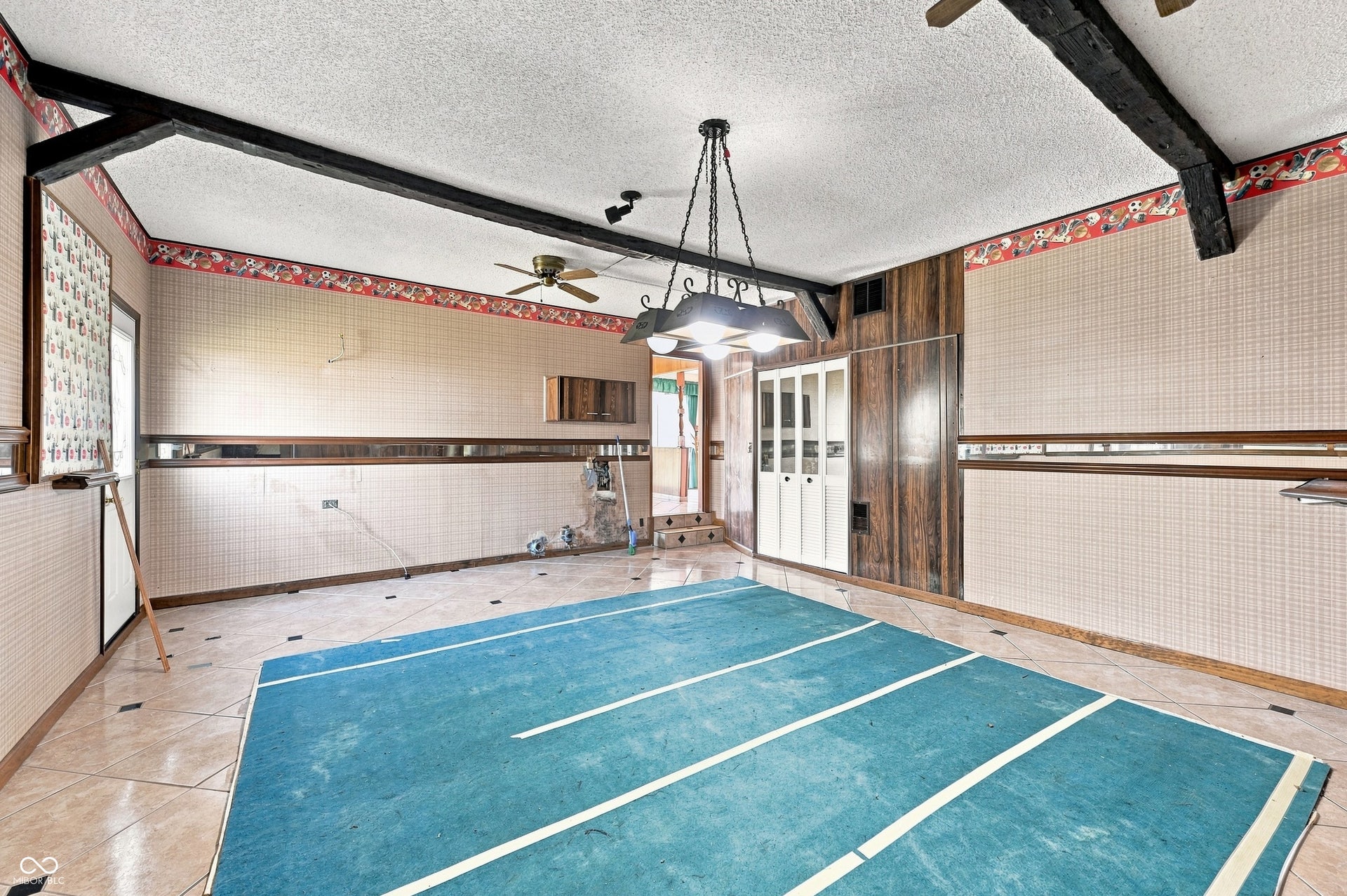 19 x 18 Game Room former garage, can be converted back if desired.