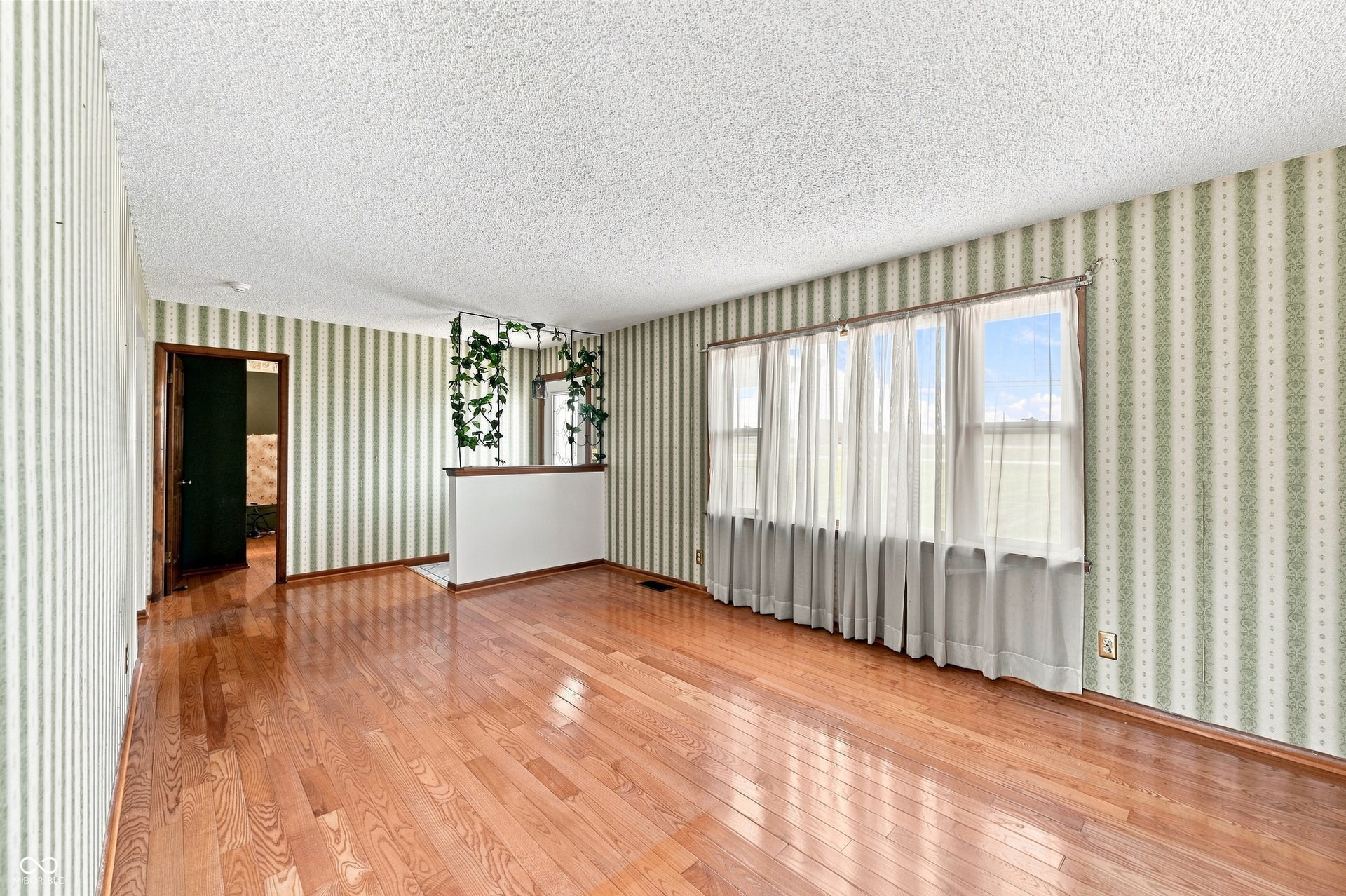23 x 13 Living Room with hardwood floors.
