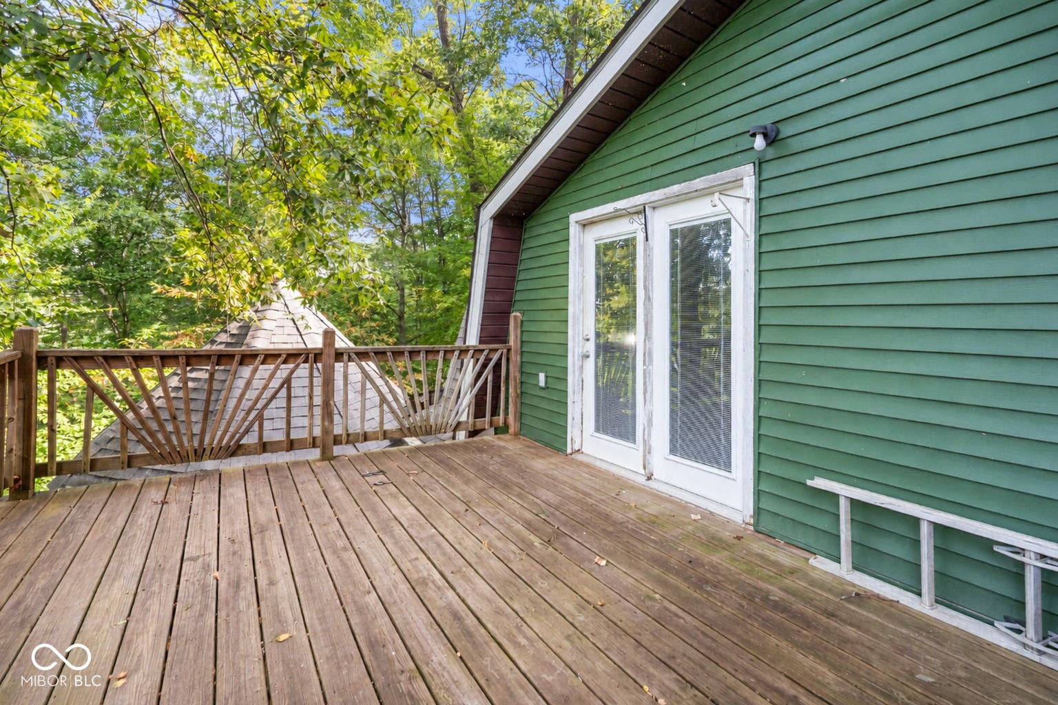 Wood plank deck with decorative railing