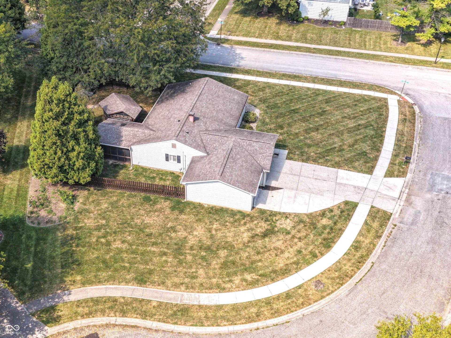 From above, you can really appreciate the home's spacious 0.41-acre setting, mature trees and the additional breathing room created by its cul-de-sac location.