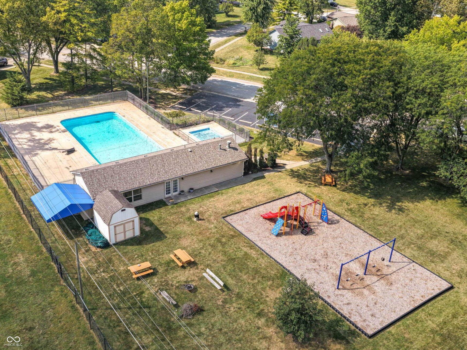 Enjoy neighborhood amenities including a pool, clubhouse and playground, with common-area maintenance and snow removal included in the association fee. Report