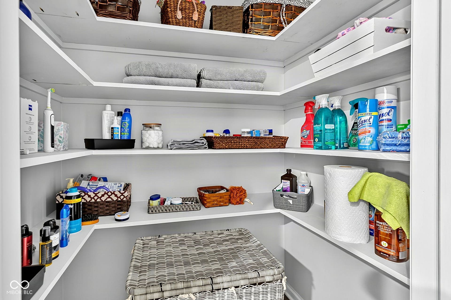 Built-in corner shelving with a white finish, offering multi-level storage