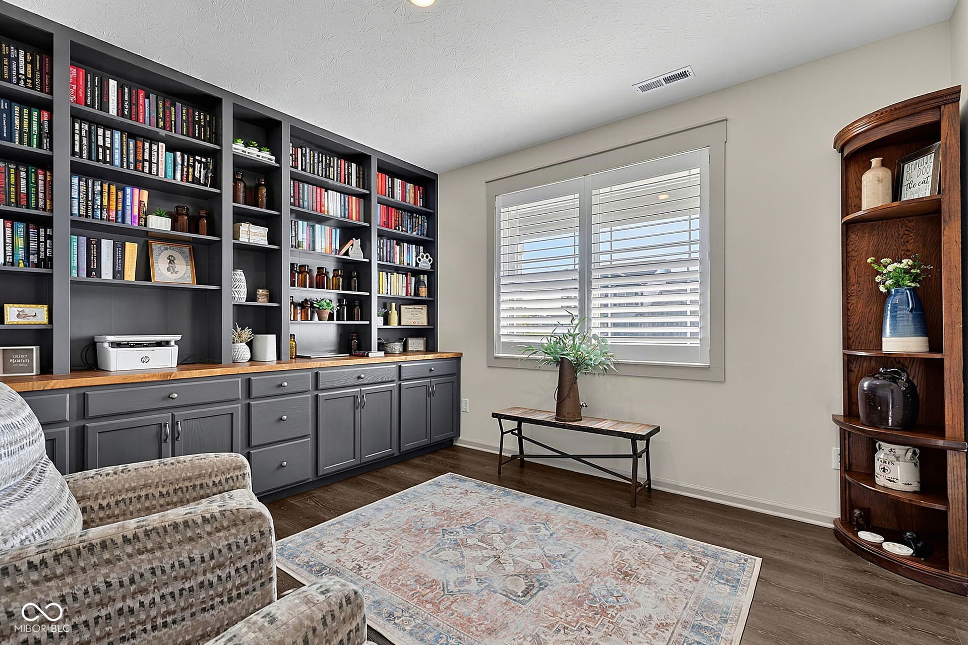 Built-in shelving with lower cabinetry and wood-finish countertops